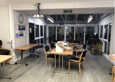nice big room with tables and chairs to chill out and relax