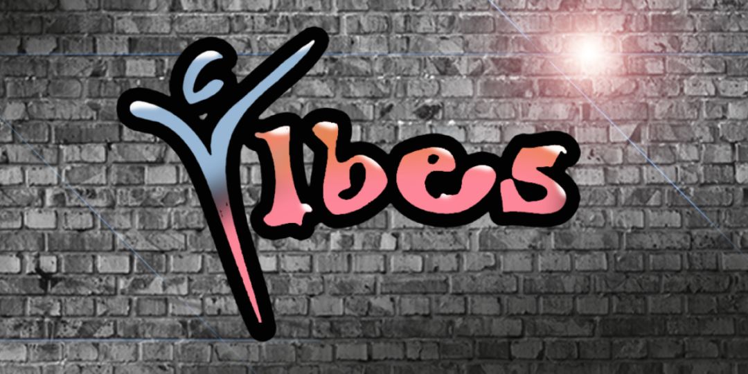 The word 'Vibes' graffitied on a black brick wall