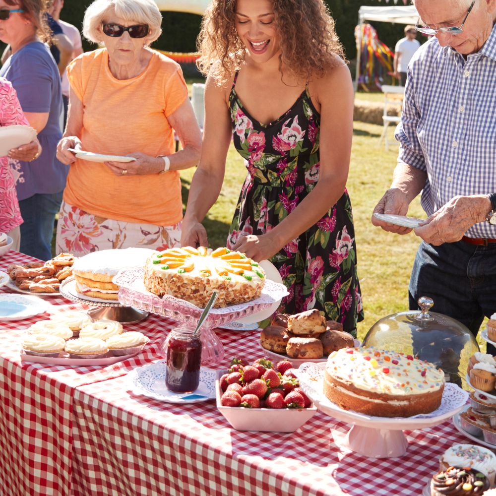 People fundraising by doing a cake sale