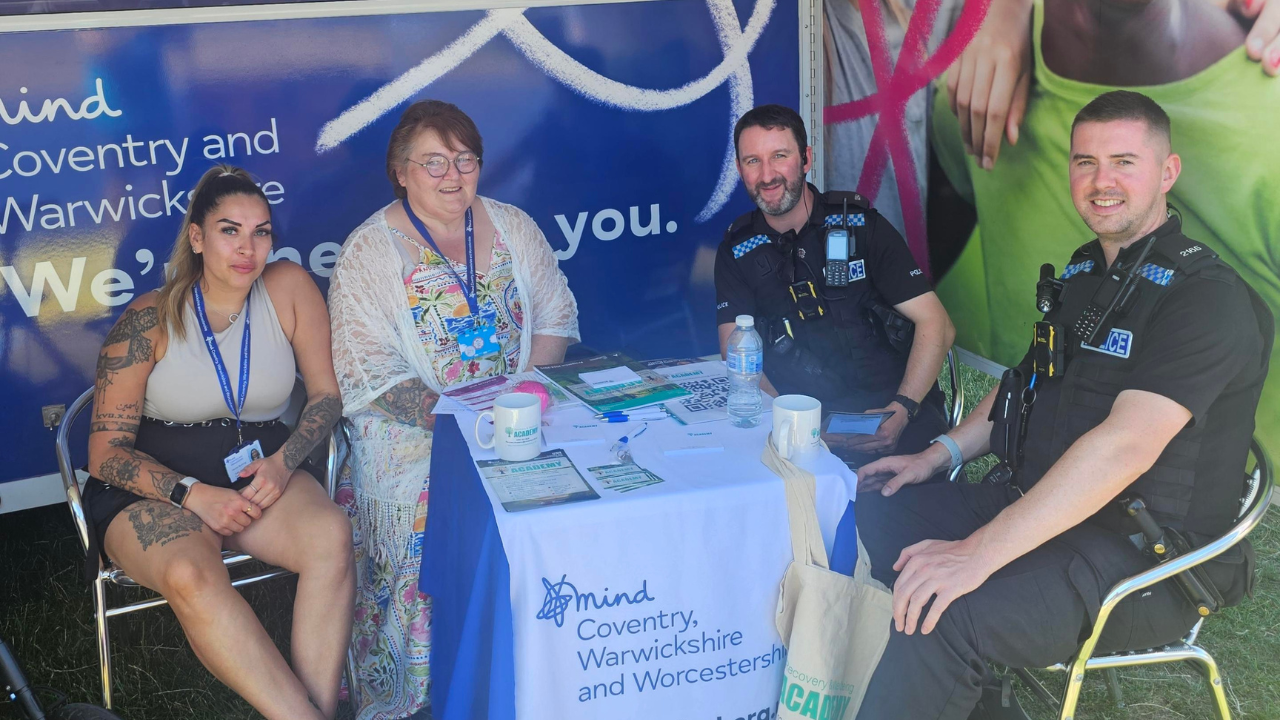 Two women and two policemen sat around a table